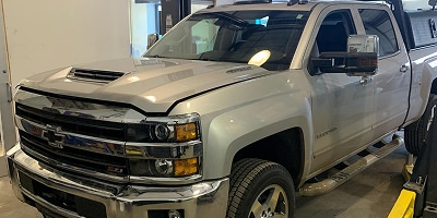 a silver truck parked in a showroom