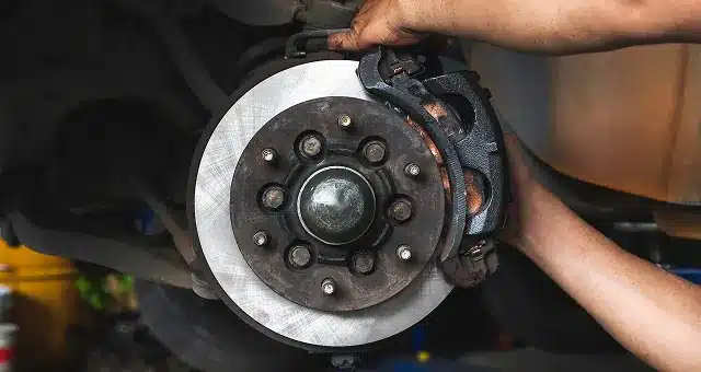a person holding a disc brake